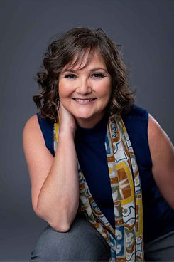 Liz in Blue leaning forward small 2022.jpeg