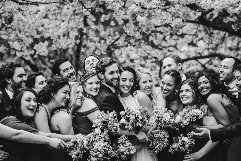 Groomsmen under cherry blossoms at spring wedding at the Brazilian Room in Berkeley, CA
