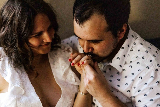 fiance kissing his partner's engagement ring