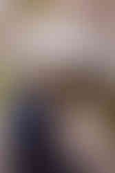 Bride and groom under cherry blossoms at the Brazilian Room in Berkeley, CA on a rainy wedding day