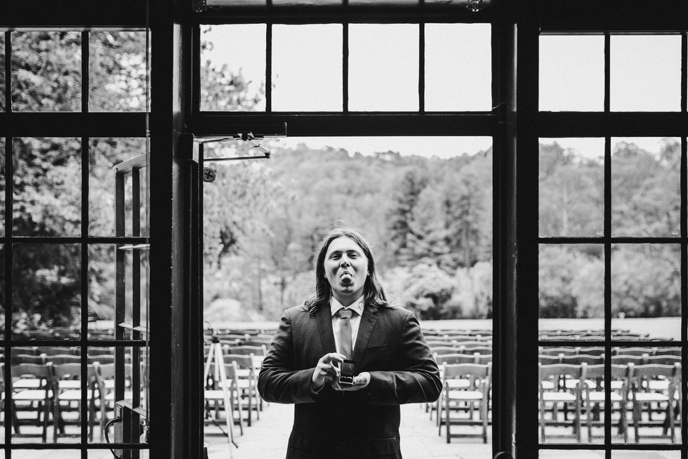 Groomsmen holding rings at the Brazilian Room in Berkeley, CA