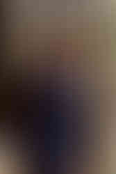 Groom looking out window at the Brazilian Room in Berkeley, CA