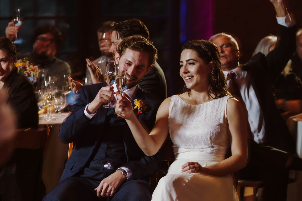 Bride and groom cheers during Wedding toasts at the Brazilian Room in Berkeley, CA