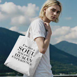 Spiritual canvas-like tote bag with minimalist typography featuring the phrase "I'm Just a Soul Having a Human Experience", designed for mindful, introspective, and nature-connected individuals.