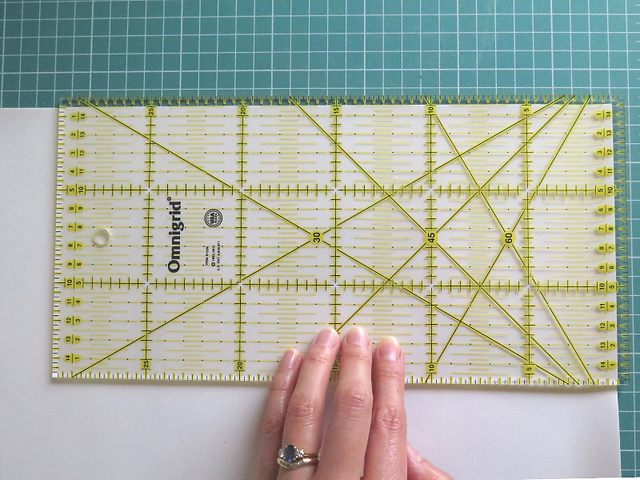 Omnigrid ruler 30cm x 15cm laid on the InvisiGrip film with 5mm overhang at two edges to ensure the final piece is slightly less than the surface of the ruler