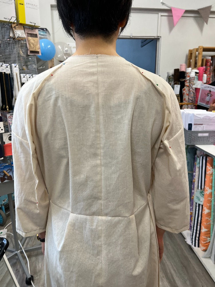 Back view of Kay Hallows of MingMakes in a calico toile of the Zadie Jumpsuit by Paper Theory, with a dart pinned out at the upper shoulder and arm