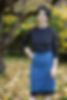 Front view of Tilly and the Buttons Frankie T-Shirt in black jersey with black lace sleeves, tucked into petrol Bibi Skirt with black lace trim