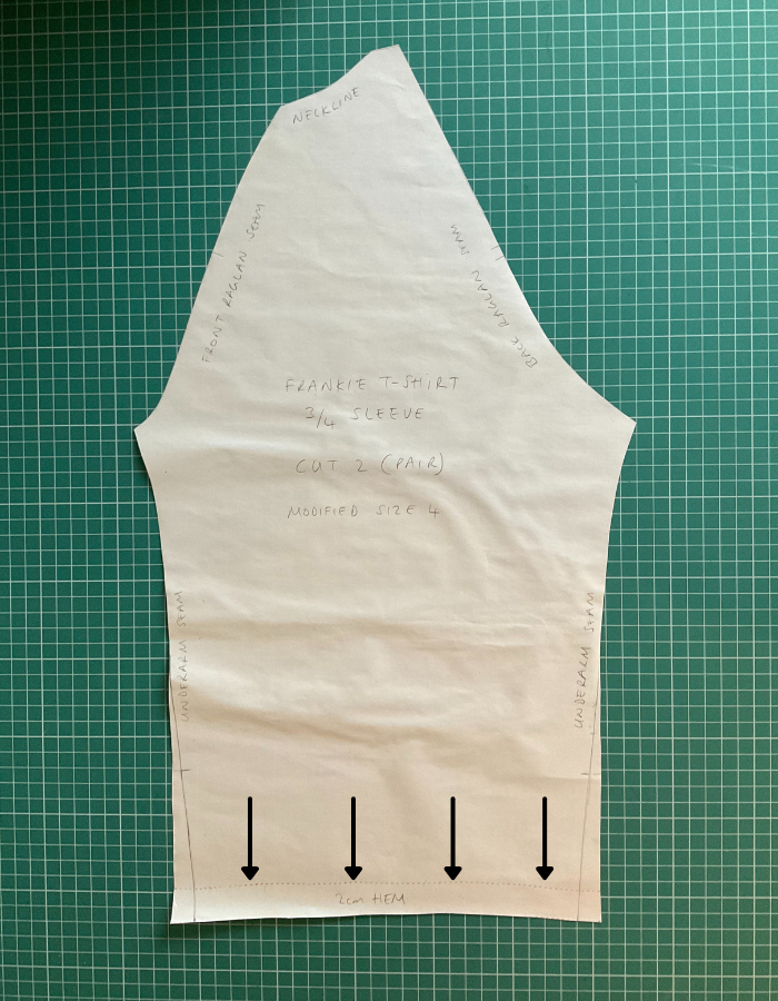 Pattern piece of Tilly and the Buttons Frankie T-Shirt sleeve showing line of where to cut if not requiring a hem to be turned up, 2cm before the edge of the piece