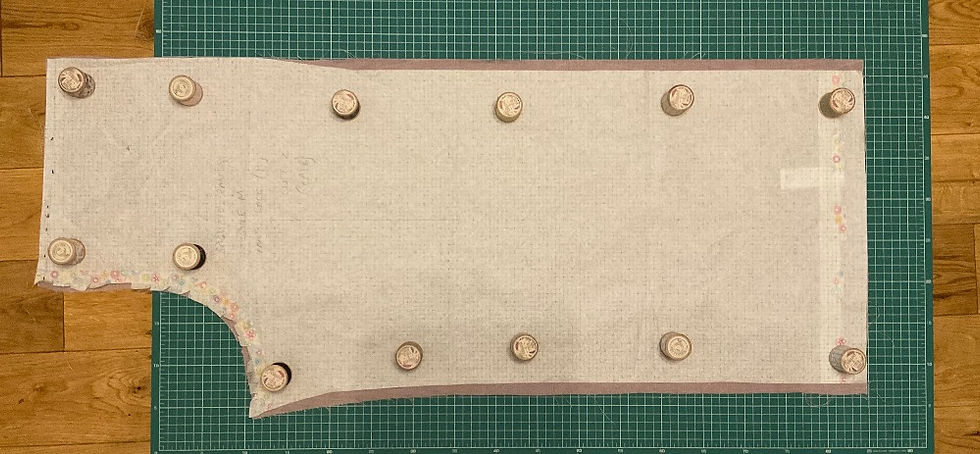 New pattern piece for the Saguaro Set Trousers or pants by the Friday Pattern Company cut in size S laid over the fabric piece cut in size M