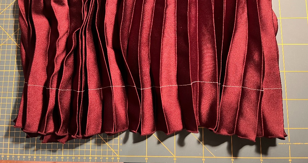 An alteration shortening a RTW pleated skirt