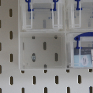 Screw holding in Really Useful Boxes unit of 16 x 1.4 litre boxes containing sewing storage items