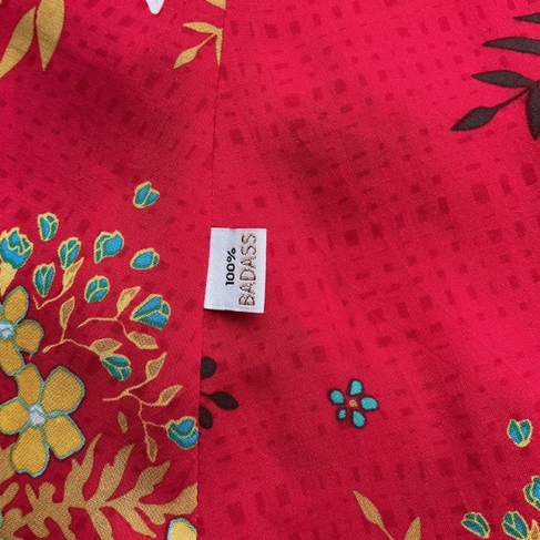 Close up view of a side label saying 100% Badass on the side seam of the Liberty ZIna Wrap Skirt / Simplicity 8606 in Art Gallery Fabrics summerdress dreams in rayon challis