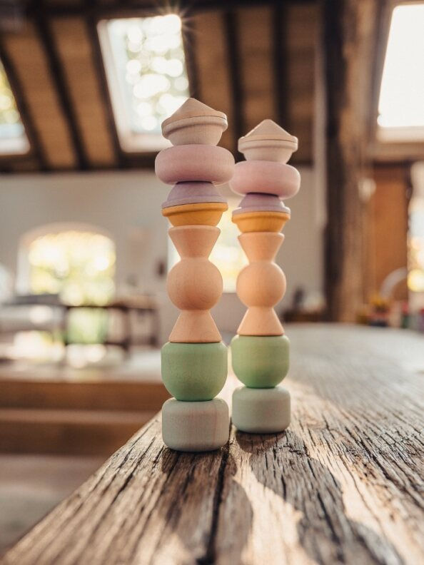Thumbnail: Wooden spinning tops and stacking pieces inspired by sweet treats for open-ended play and problem-solving activities
