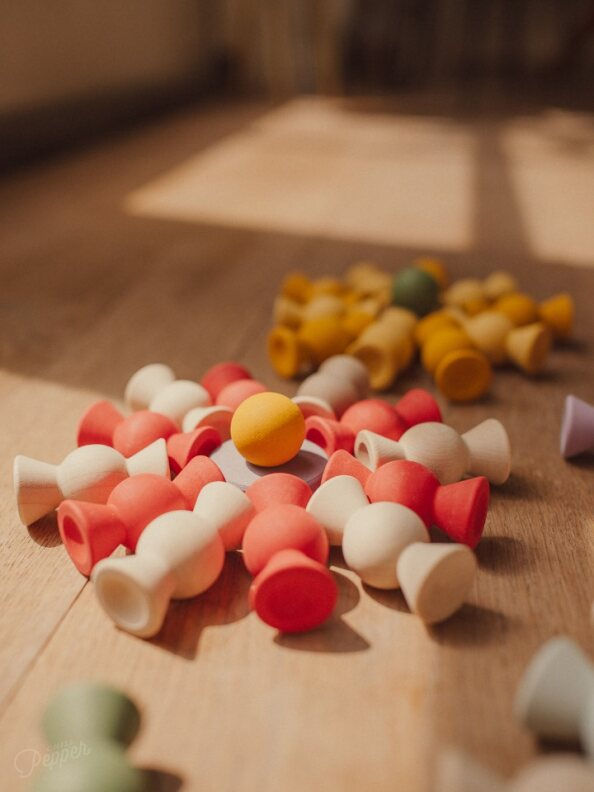 Thumbnail: Wooden loose parts toy in candy shapes and bright red velvet colors for sorting, pattern making, and mandala creations