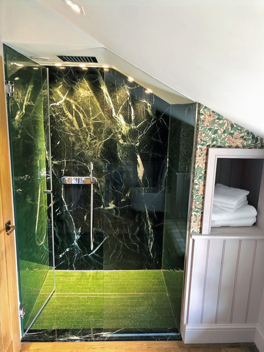 Italian marble shower wall with Moroccan glazed tiles