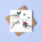 An illustrated Mother's Day card with collaged elements. The card rests on a square brown envelope and lilac background.