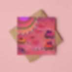 A colourful illustrated greeting card of tropical lovebirds. The card rests on a square brown envelope and pink background.