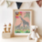A colourful,  illustrated, framed "Party Animals" print of giraffes. The artwork rests on a toy shelf in a nursery.