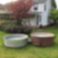 old dirty hot tubs in front yard.jpg