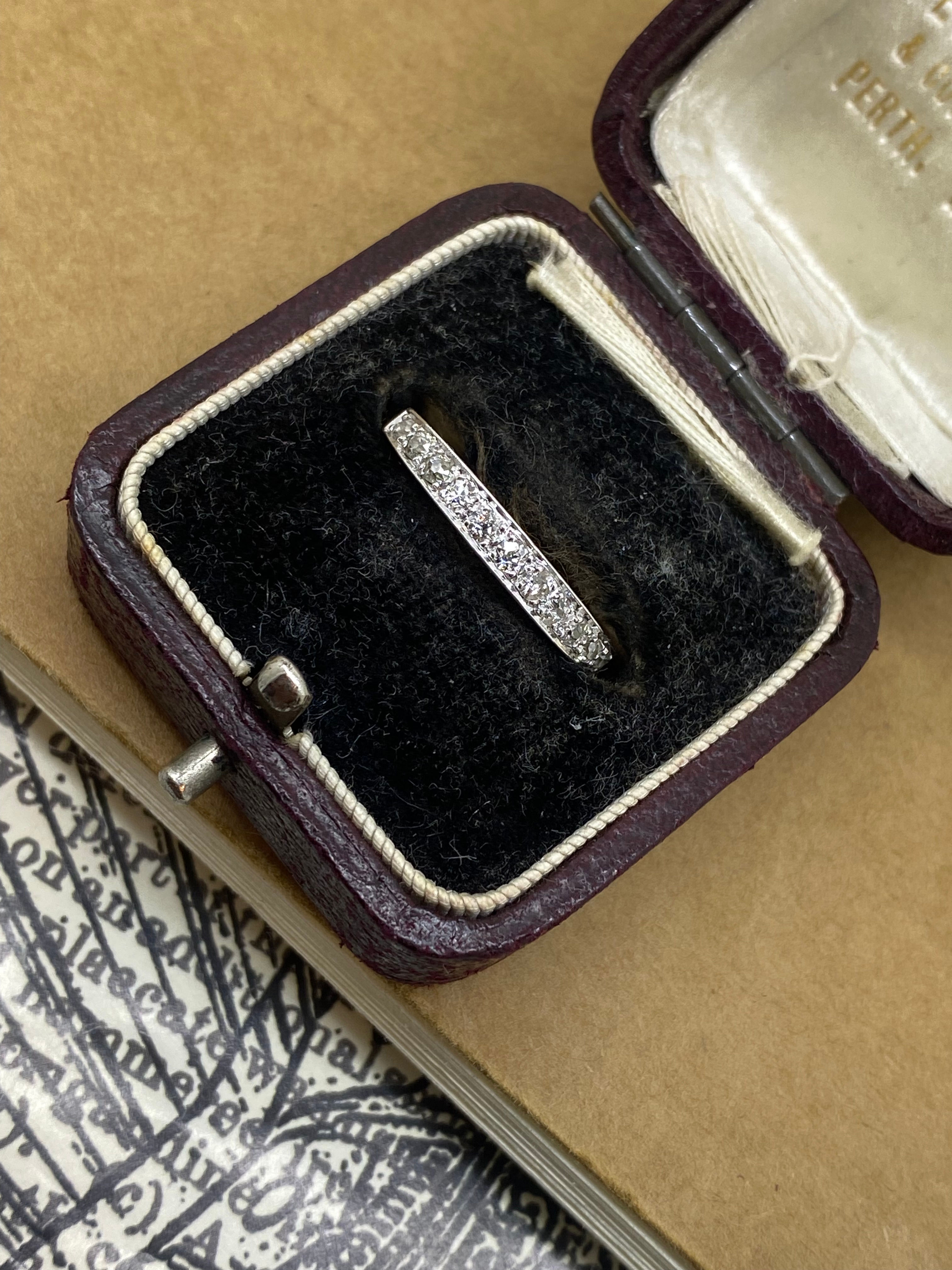 An Art-Deco 12-Stone Grain Set Old Cut Diamond (0.50ct) Band in 18K White Gold