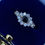 Thumbnail: White & Blue Sapphire Cluster Flower-Shaped English c1969 Ring in 9K Yellow Gold
