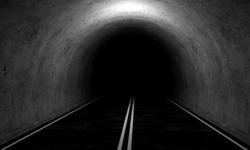 A roadway leading into the darkness