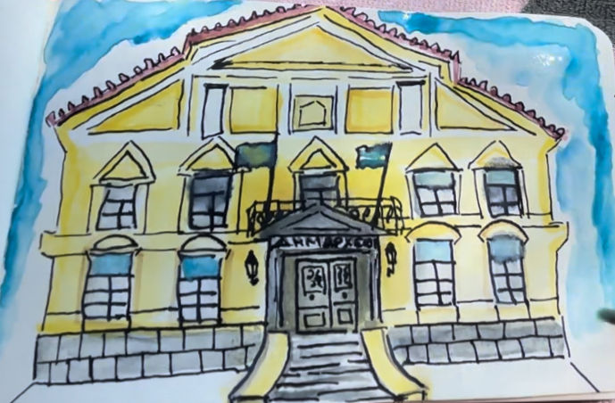 Yellow colored old townhall of Vathy, Samos, Greece - Large oversized windows and flags blowing in the wind