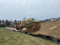 Excavators digging a slope for site improvement