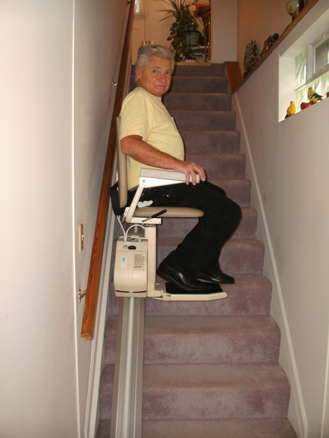 Elderly man on stairlift, independent living home remodel