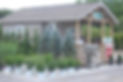 Small plant nursery building with potted plants