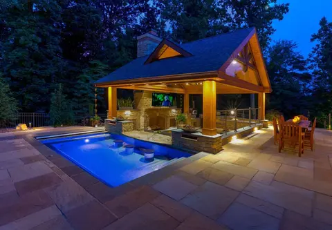 Beautifully lit pool and gazebo at night