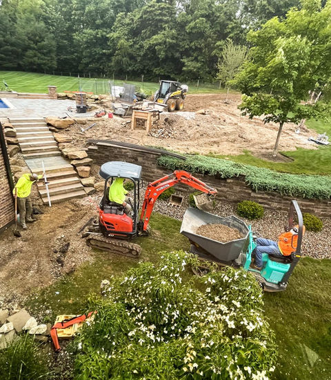Excavators and workers on a site improvement project