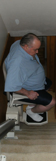Man on stairlift, independent living home remodel
