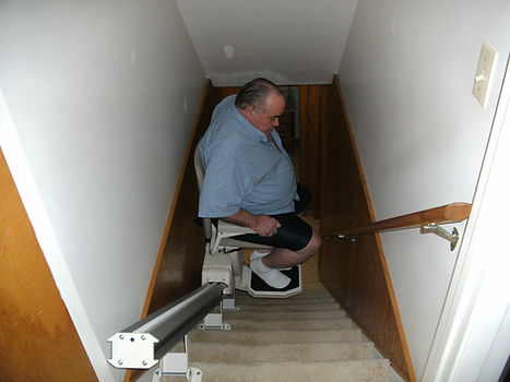 Man on stair lift for independent living