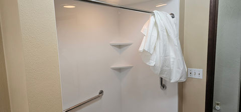 Accessible shower with grab bar for Independent Living Home Remodel.