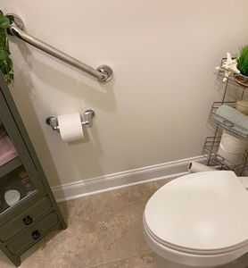 Wall-mounted grab bar as part of mobility transfer aid systems.