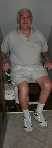 Man using a stair lift for independent living home remodel