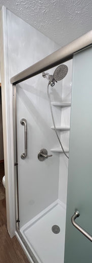 Independent living shower remodel with grab bars