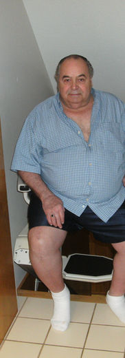 Older man sitting in home, independent living