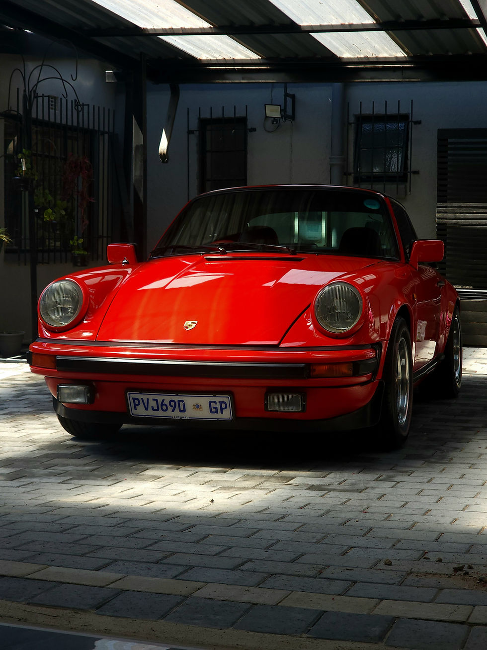 Clean red classic sports car, perfect for car detailing