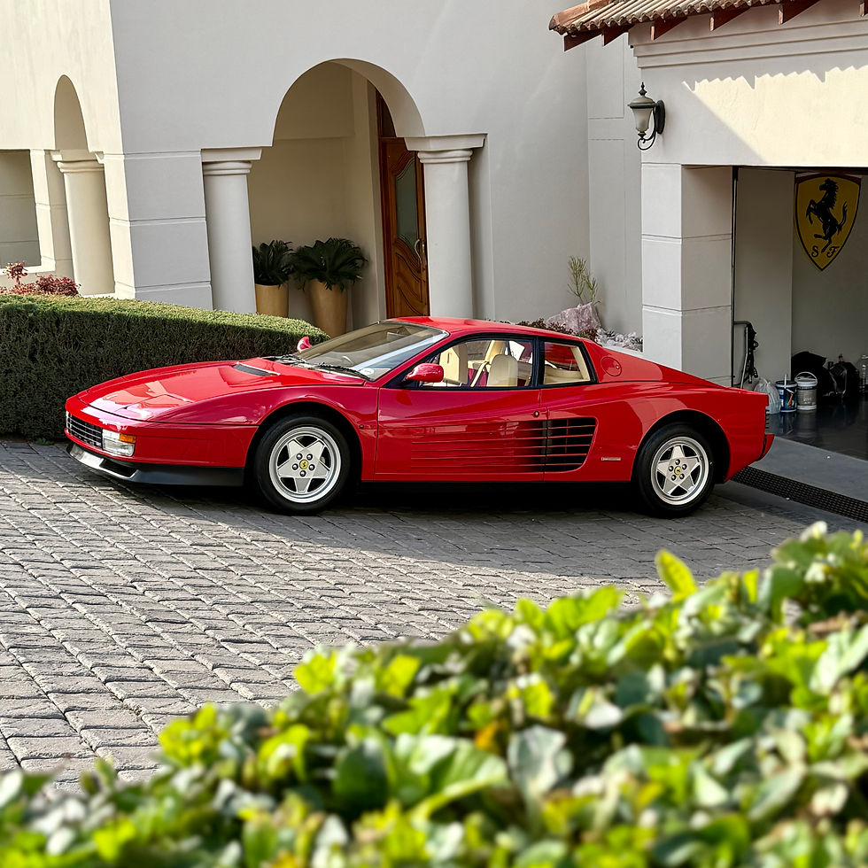 Red Ferrari Testarossa looking pristine from vehicle detailing