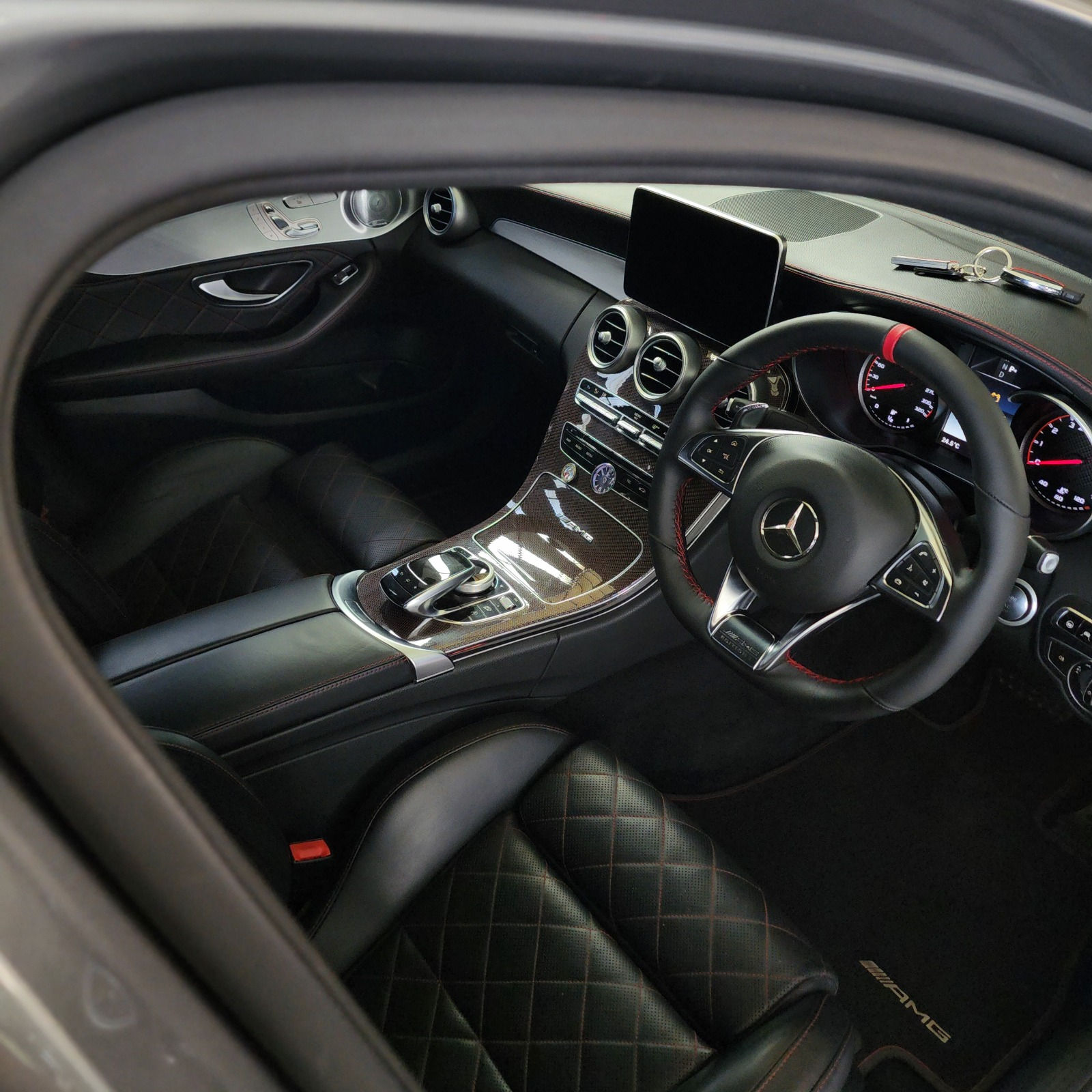 Luxury car interior with black leather seats