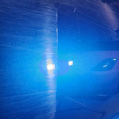 Shiny blue polished surface with reflections