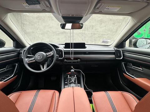 Leather treatment service enhancing a luxury car's interior by Diabolic Detailing in Fontana