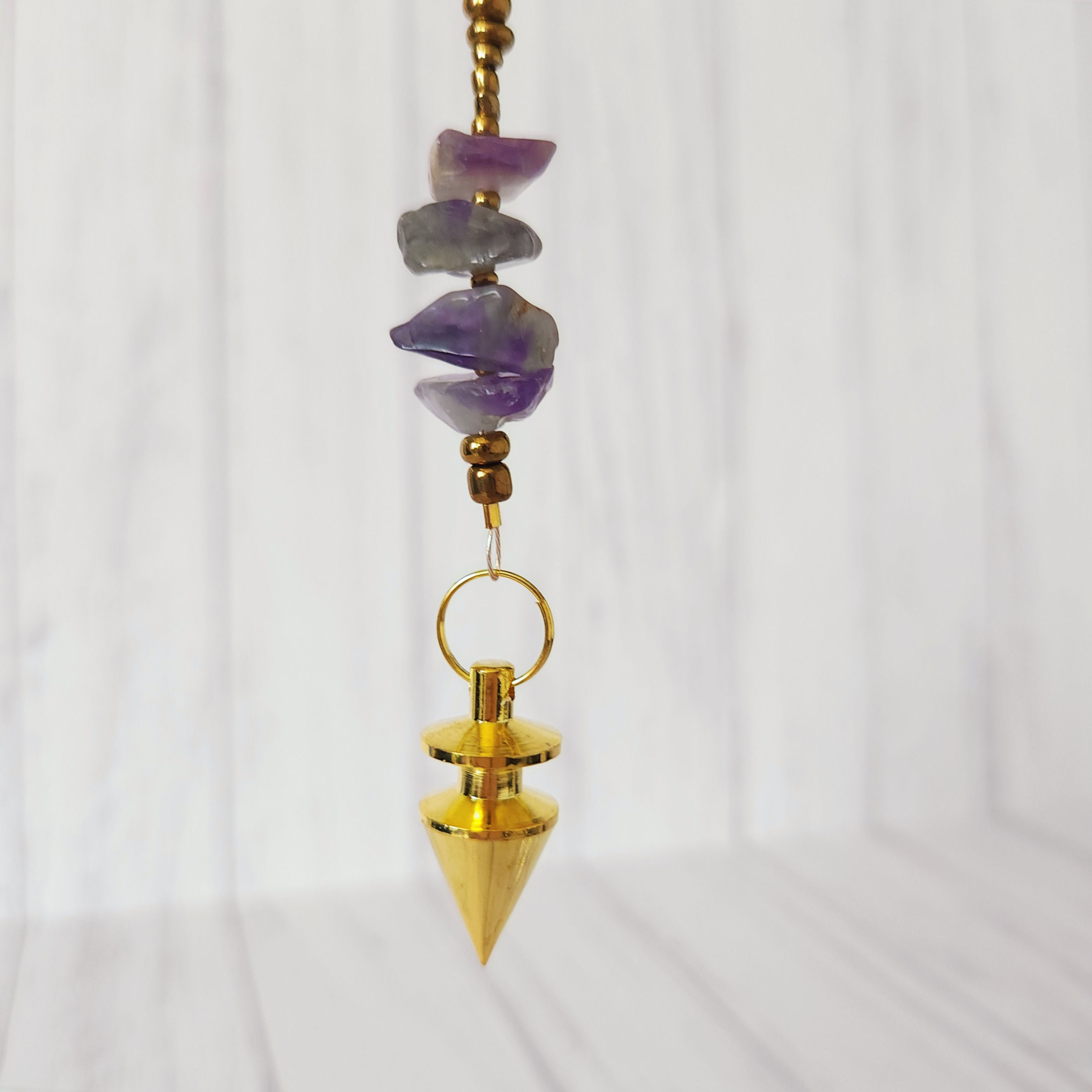 Gold Tone Pendulum With Amethyst