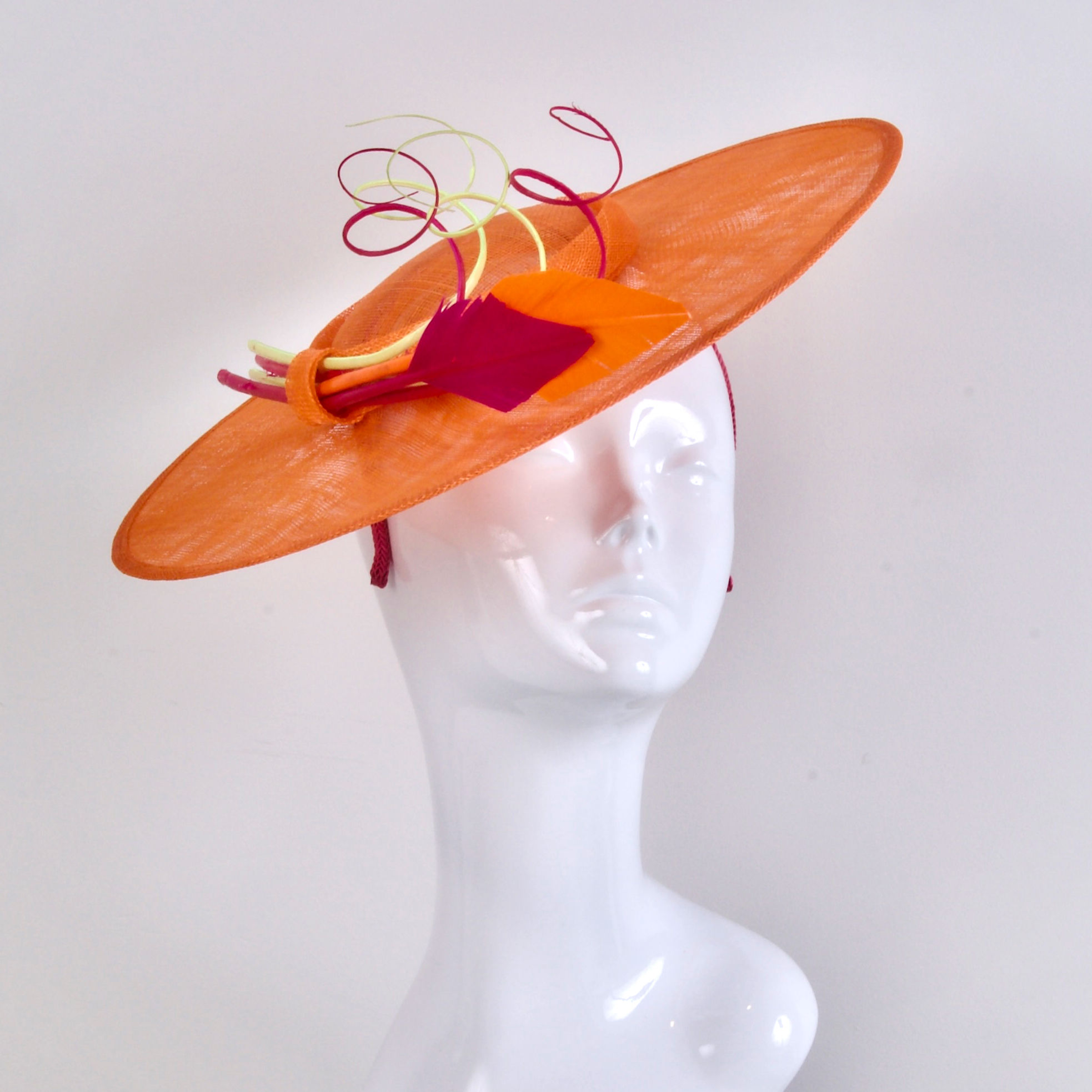Orange hat with pink and yellow trimmings