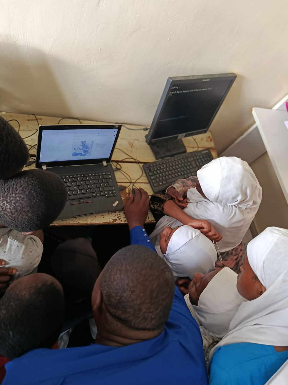 Close-up of a female student using a laptop during a computer class