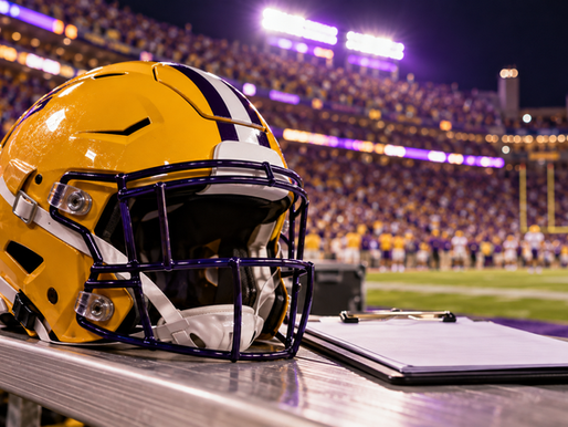LSU-style purple-and-gold football helmet beside an availability-report clipboard in Tiger Stadium at night
