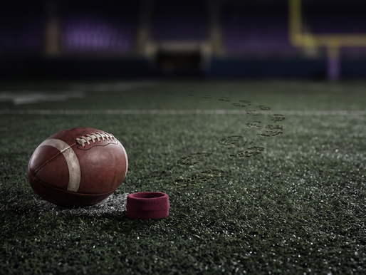 Football outside a worn quarterback pocket with maroon wristband and cleat tracks escaping toward open field before LSU faces Marcel Reed