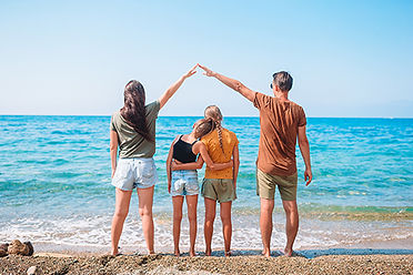 Family on the beach after purchasing a home in Lavallette real estate.